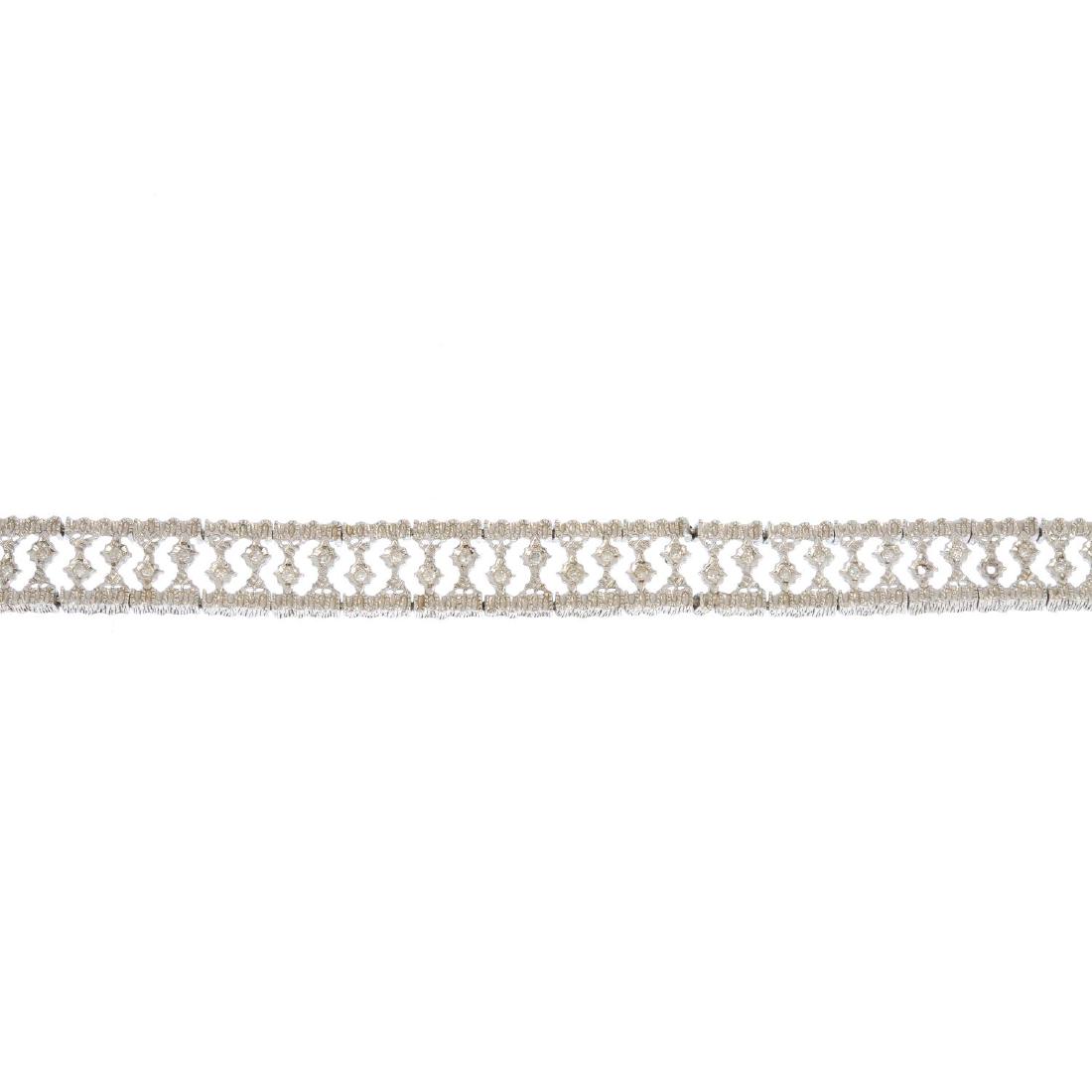 A 9ct gold diamond bracelet. Of openwork design, the (1 of 3)