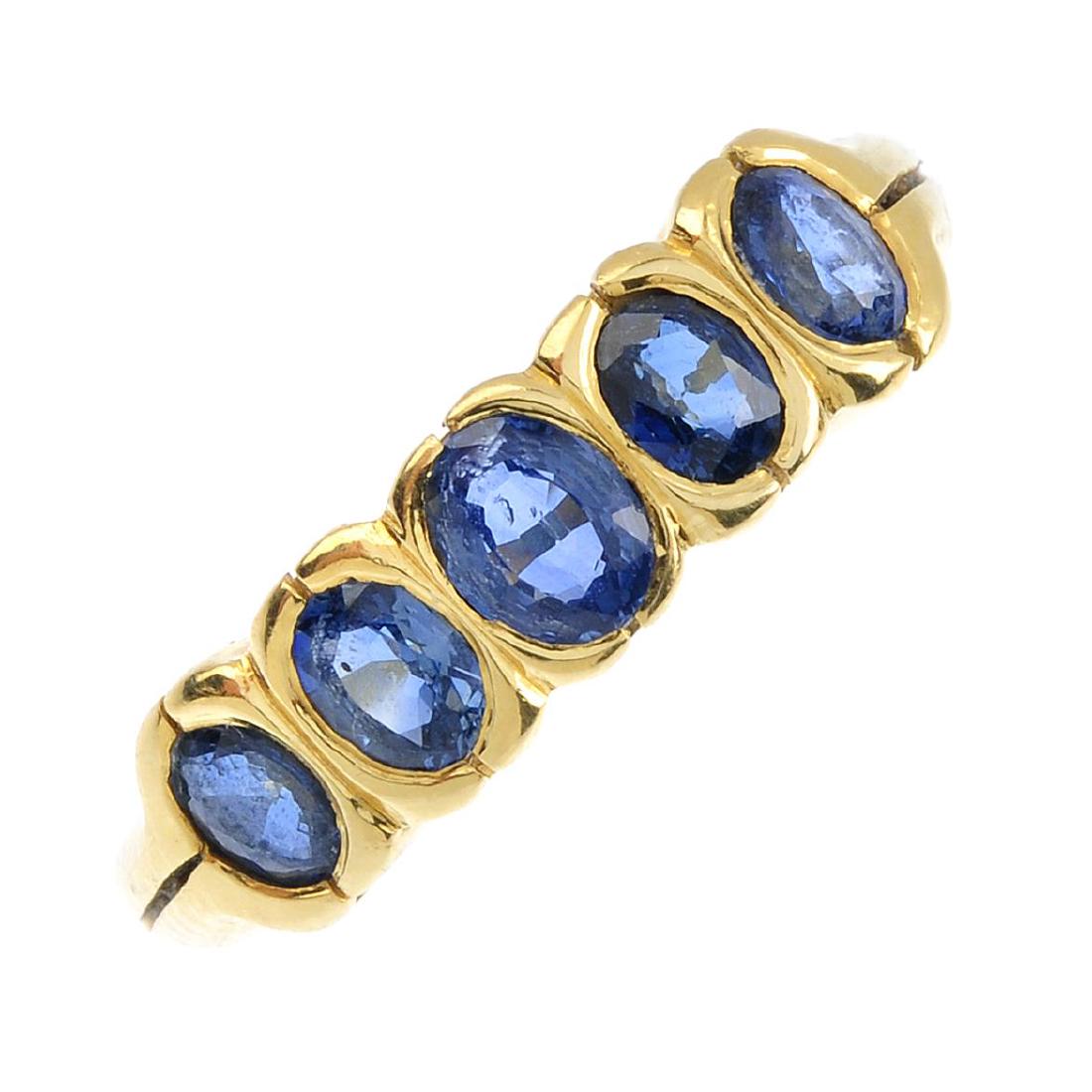 An 18ct gold sapphire five-stone ring. The oval-shape (1 of 3)