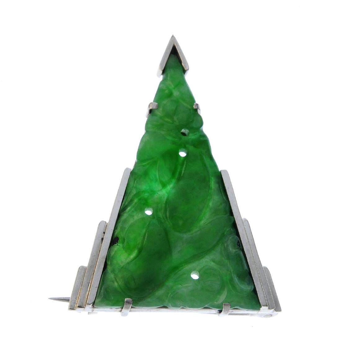 A jade brooch. The triangular jadeite panel, carved to (1 of 2)