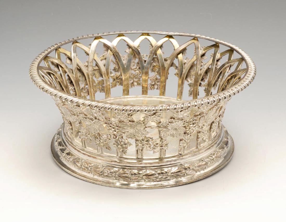 An Edwardian silver large bottle coaster, with oblique (1 of 4)