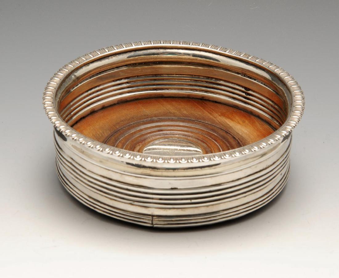 A George III silver mounted bottle coaster, the (1 of 4)