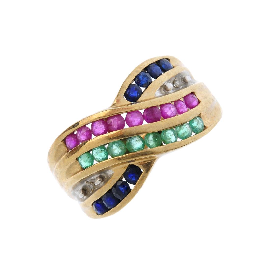 A 9ct gold gem-set crossover ring. Designed as a series (1 of 3)