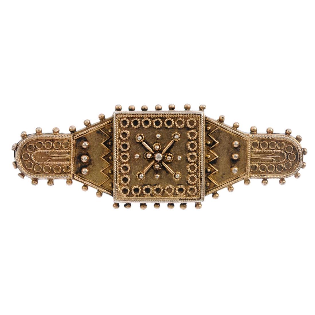 An early 20th century gold brooch and a gem-set ring. (1 of 3)