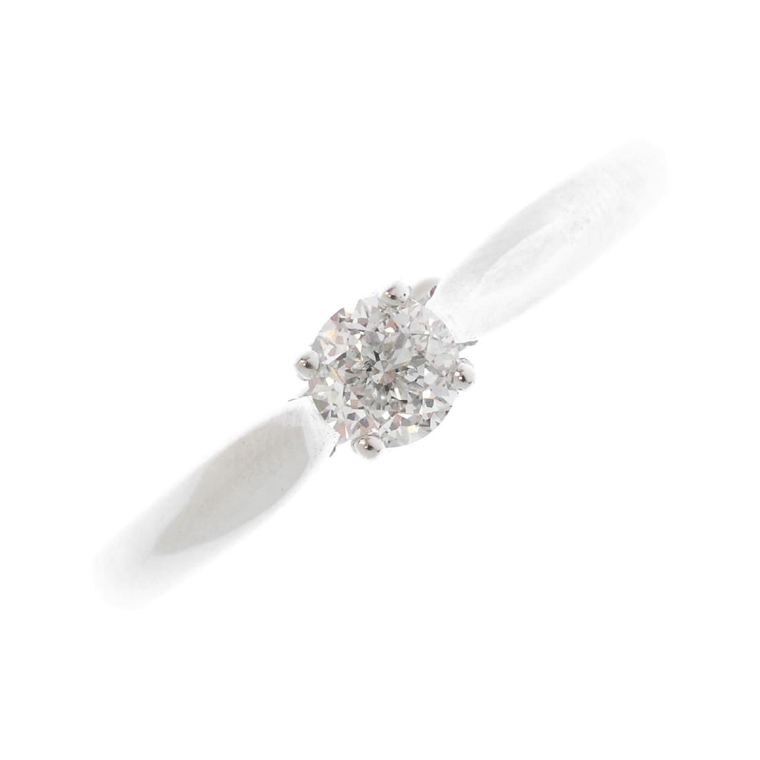 An 18ct gold diamond single-stone ring. The (1 of 3)