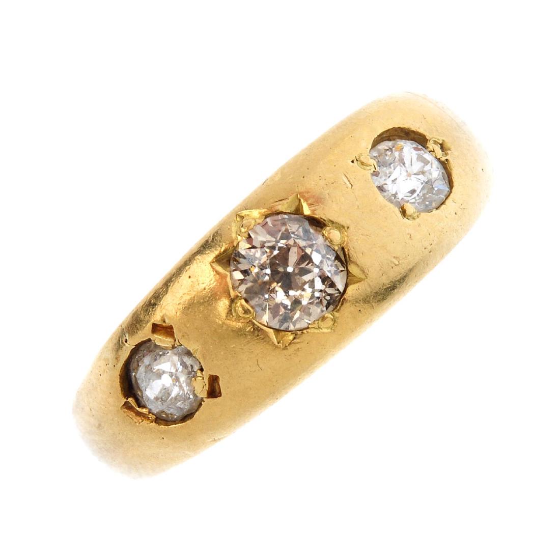 A 9ct gold diamond three-stone ring. The graduated (1 of 3)