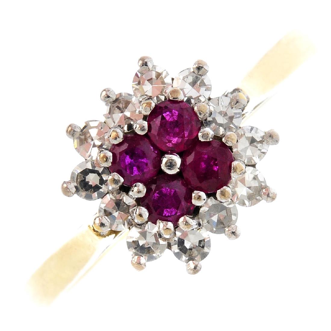 An 18ct gold ruby and diamond cluster ring. The (1 of 3)