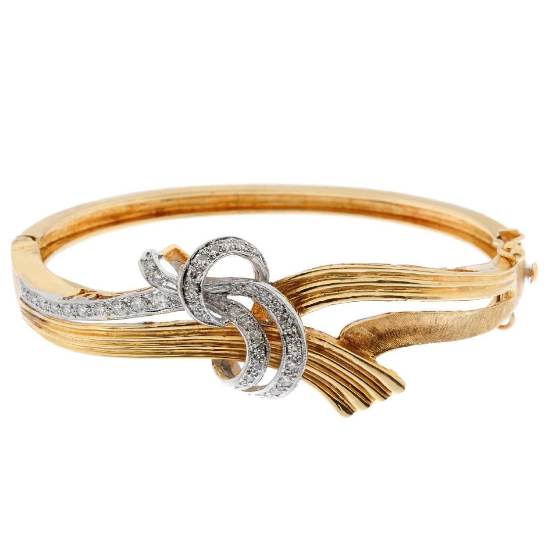 A diamond hinged bangle. Of openwork design, the (1 of 3)