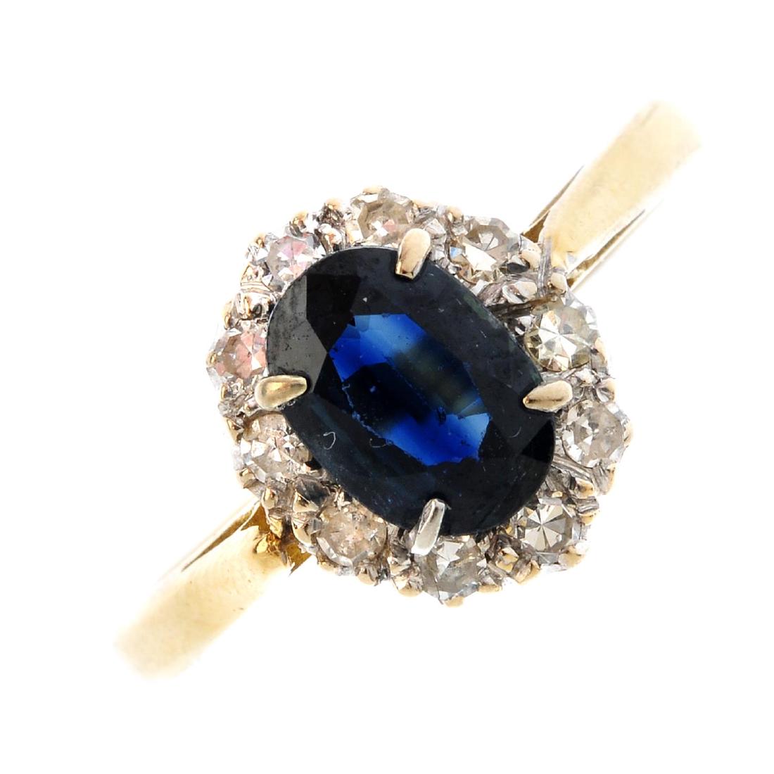 A platinum and 18ct gold sapphire and diamond cluster (1 of 3)