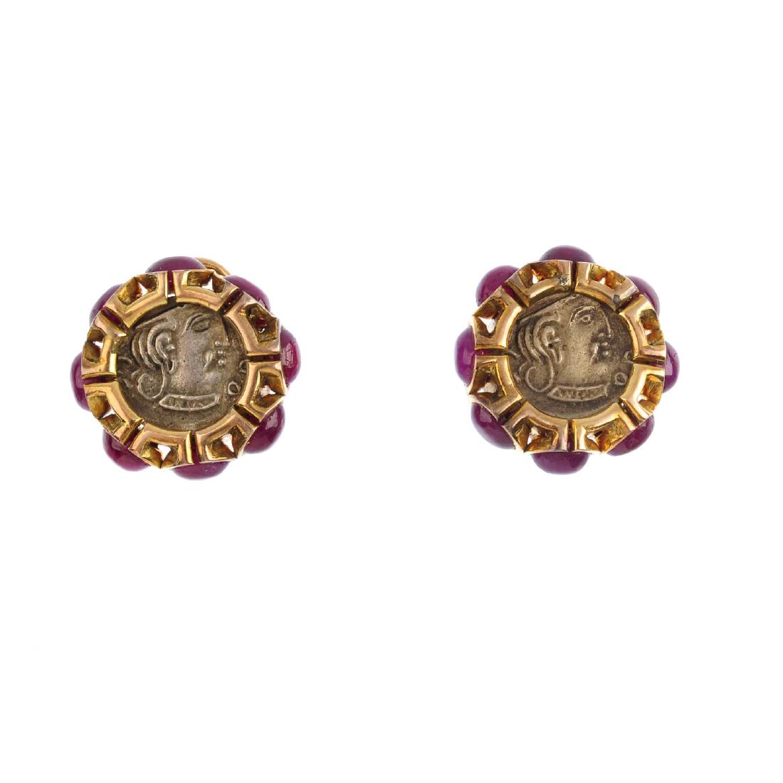 A pair of ruby cluster earrings. Each designed as a (1 of 3)