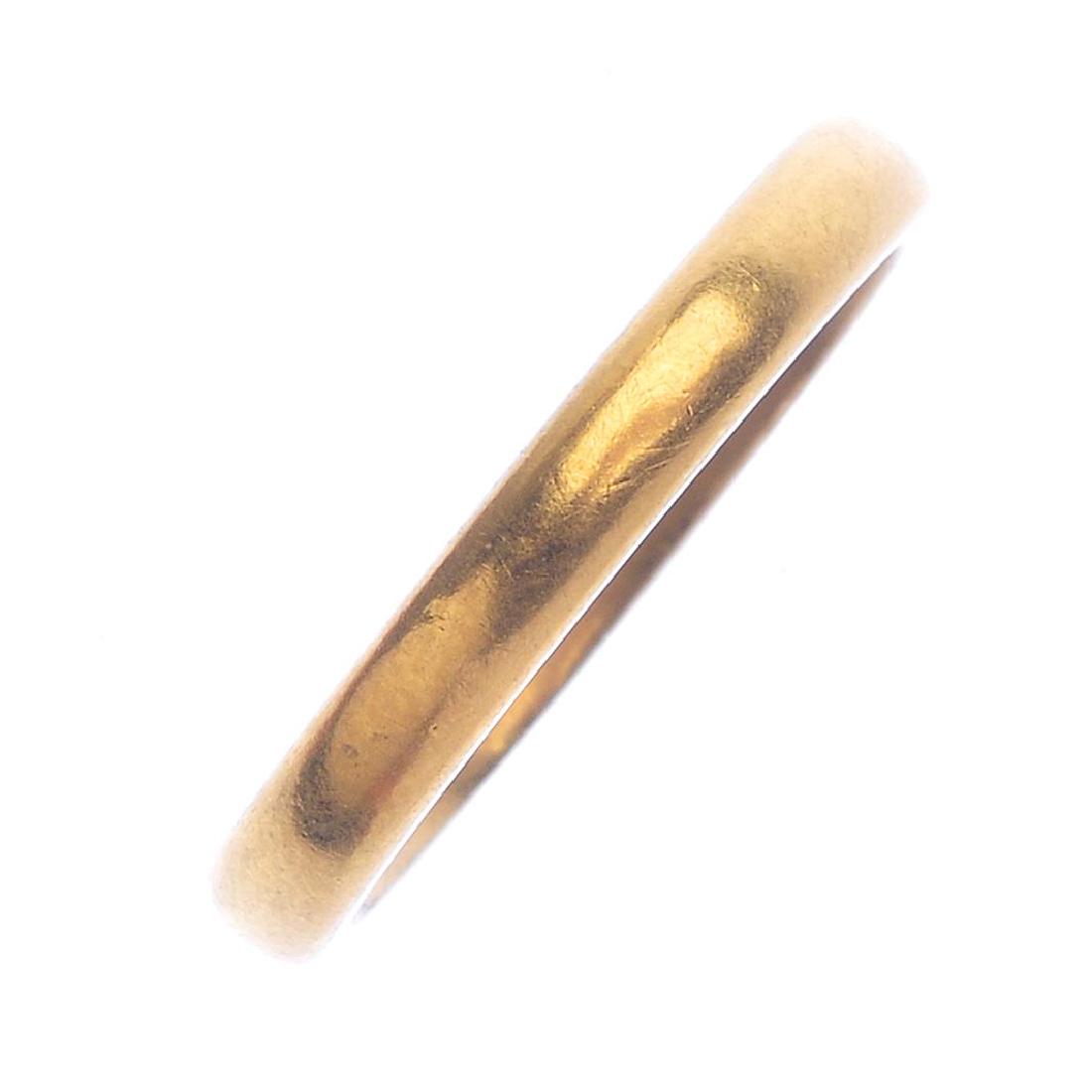 A 1930s 22ct gold and platinum band ring. The plain (1 of 2)