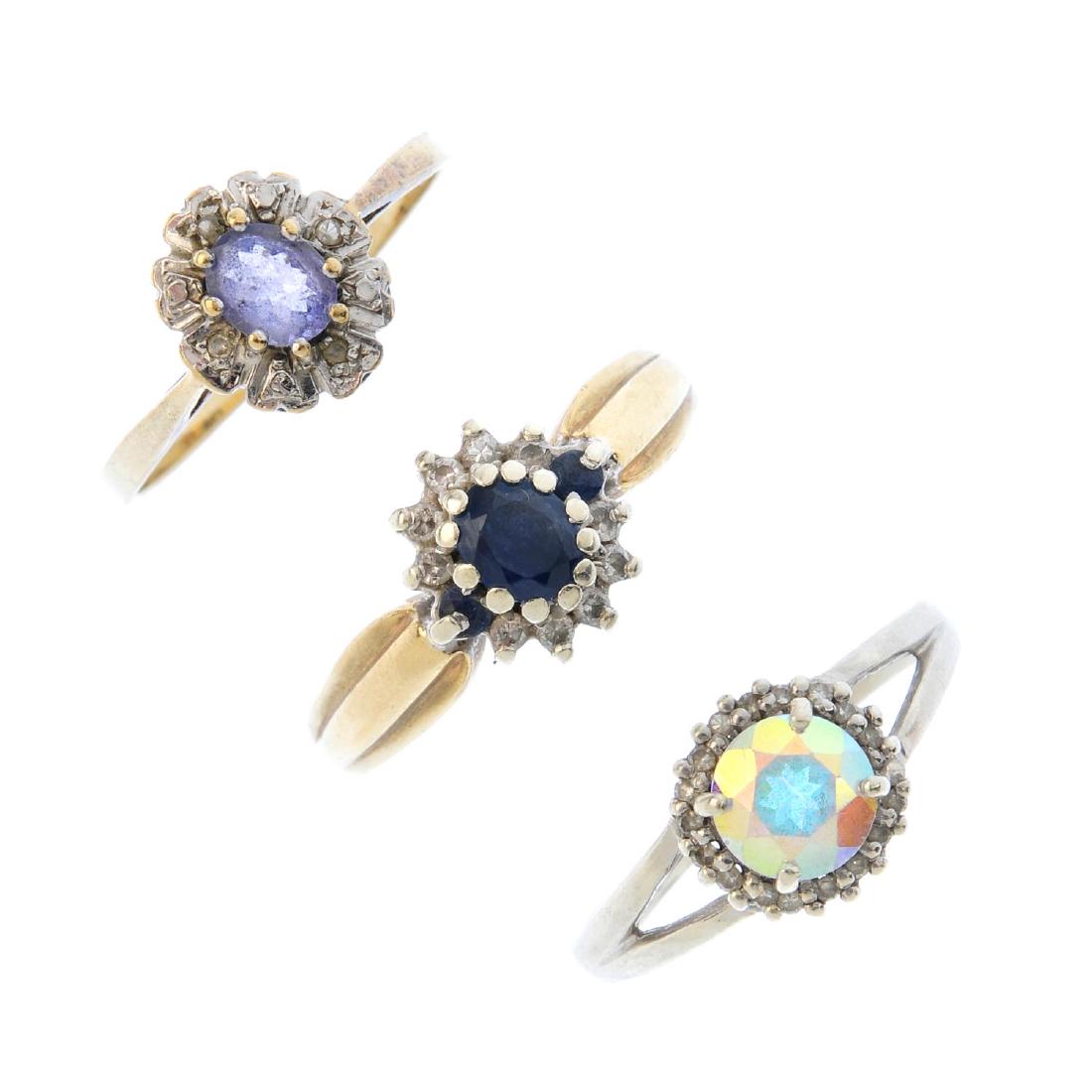 Four 9ct gold diamond and gem-set rings. To include a (1 of 4)