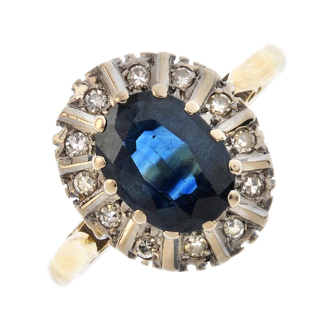 A gold sapphire and diamond cluster ring. The (1 of 3)