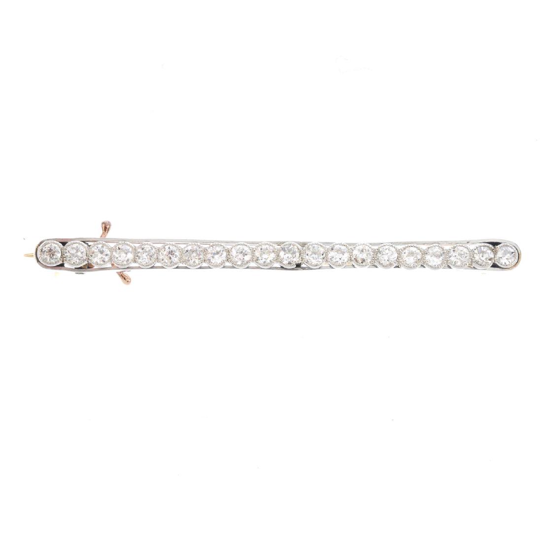 A mid 20th century diamond bar brooch. Comprising a (1 of 3)