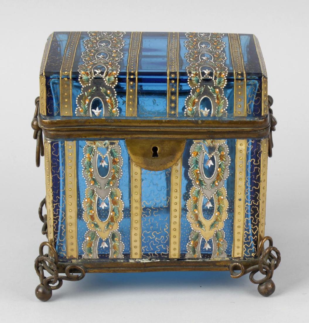 A good turquoise glass and enamel jewellery casket.: A good turquoise glass and enamel jewellery casket. Possibly Palais Royal or Moser, of canted rectangular form with hinged cover over twin loop handles on matching feet, the whole with enamelled wreat