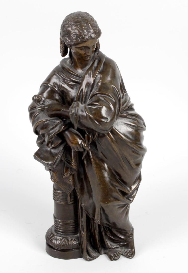 A 19th century bronze figure of a Muse. Modelled as a: A 19th century bronze figure of a Muse. Modelled as a classical-style female figure wearing full-length robes and holding a miniature bust in her left hand, a pen or sculptor's punch in her right, res
