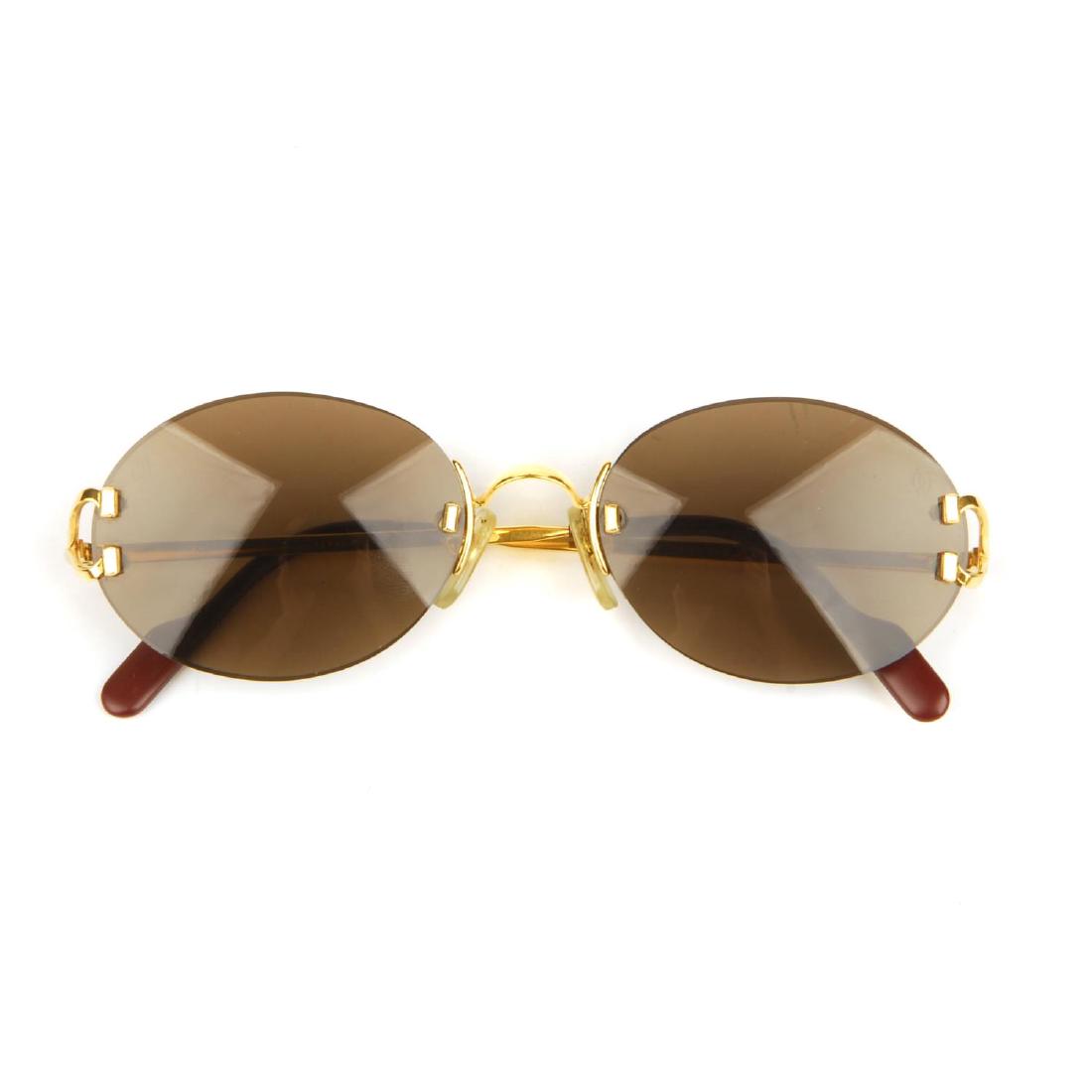 CARTIER - a pair of rimless sunglasses. Featuring oval (1 of 5)