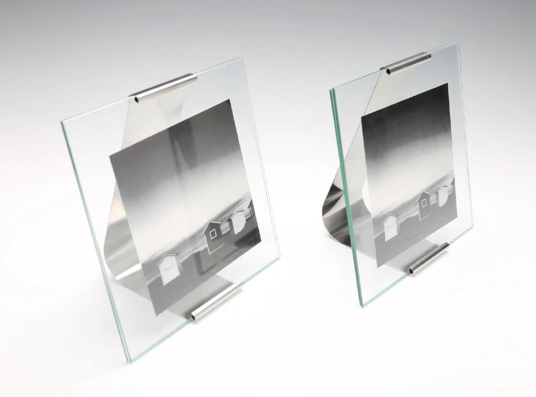 GEORG JENSEN - four medium Reflection picture frames.: GEORG JENSEN - four medium Reflection picture frames. Crafted from stainless steel and glass, designed by Jørgen Møller. Measuring 21 by 21cms. With maker's boxes.