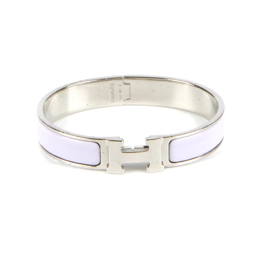 HERMÈS - a bangle. The hinged lilac enamel bangle with (1 of 3)