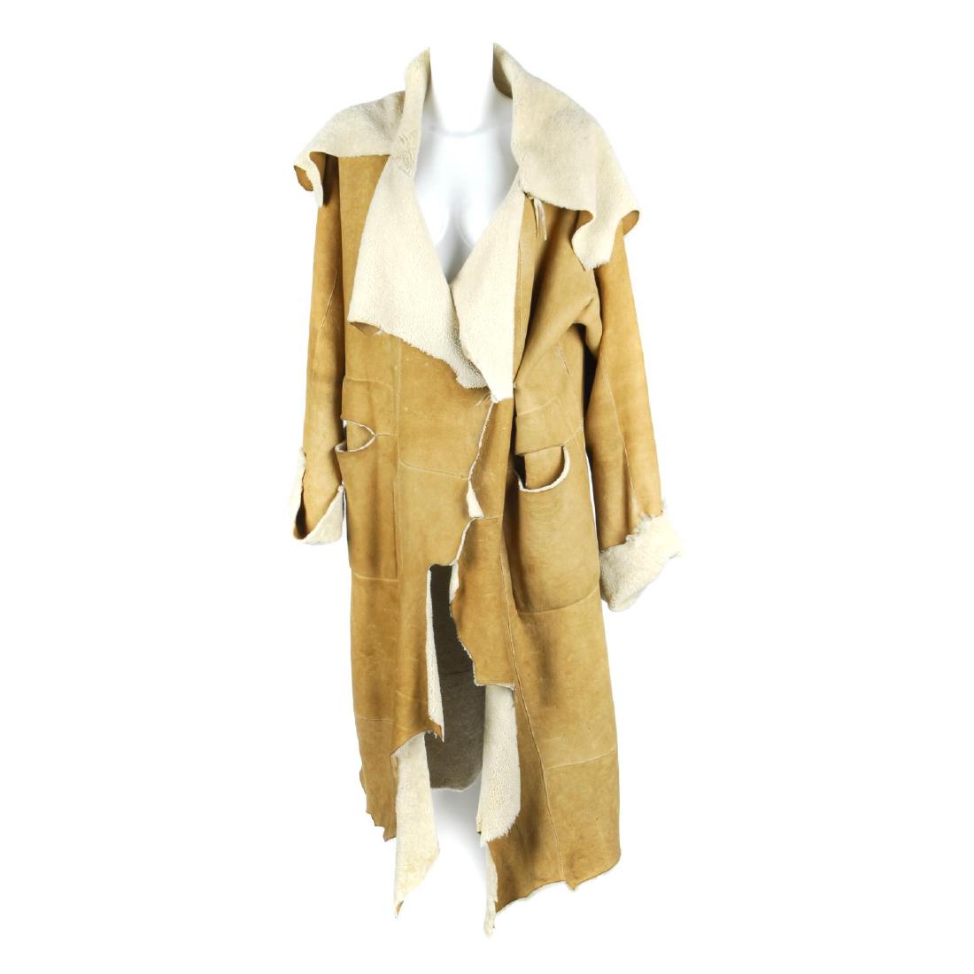 MAXFIELD PARRISH - a full-length tan Shearling: MAXFIELD PARRISH - a full-length tan Shearling sheepskin coat. Featuring a tan suede exterior and cream wool lining, designed with rough jagged cut edges, a cord and toggle waist tie and two exterior