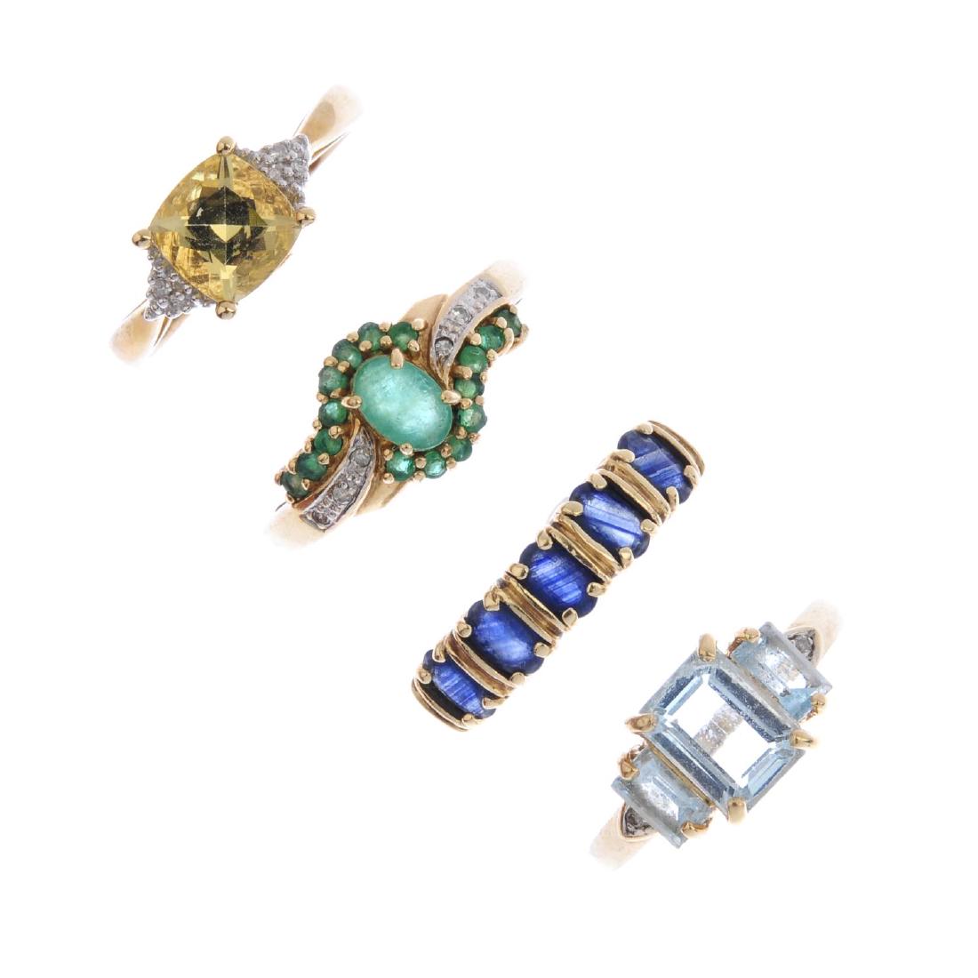 Four 9ct gold gem-set dress rings. To include a (1 of 2)