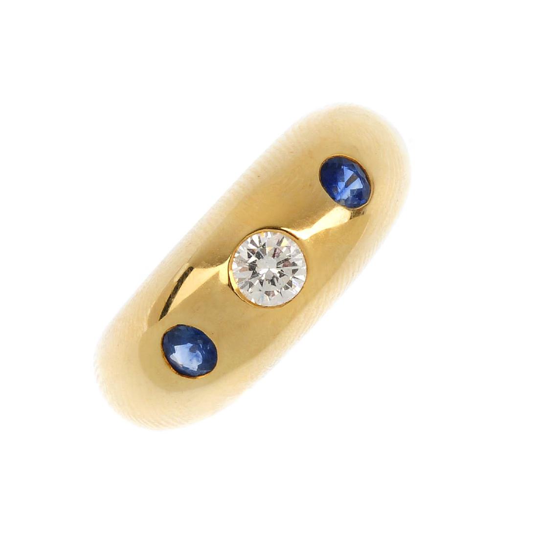 CARTIER - a diamond and sapphire three-stone ring. The (1 of 4)