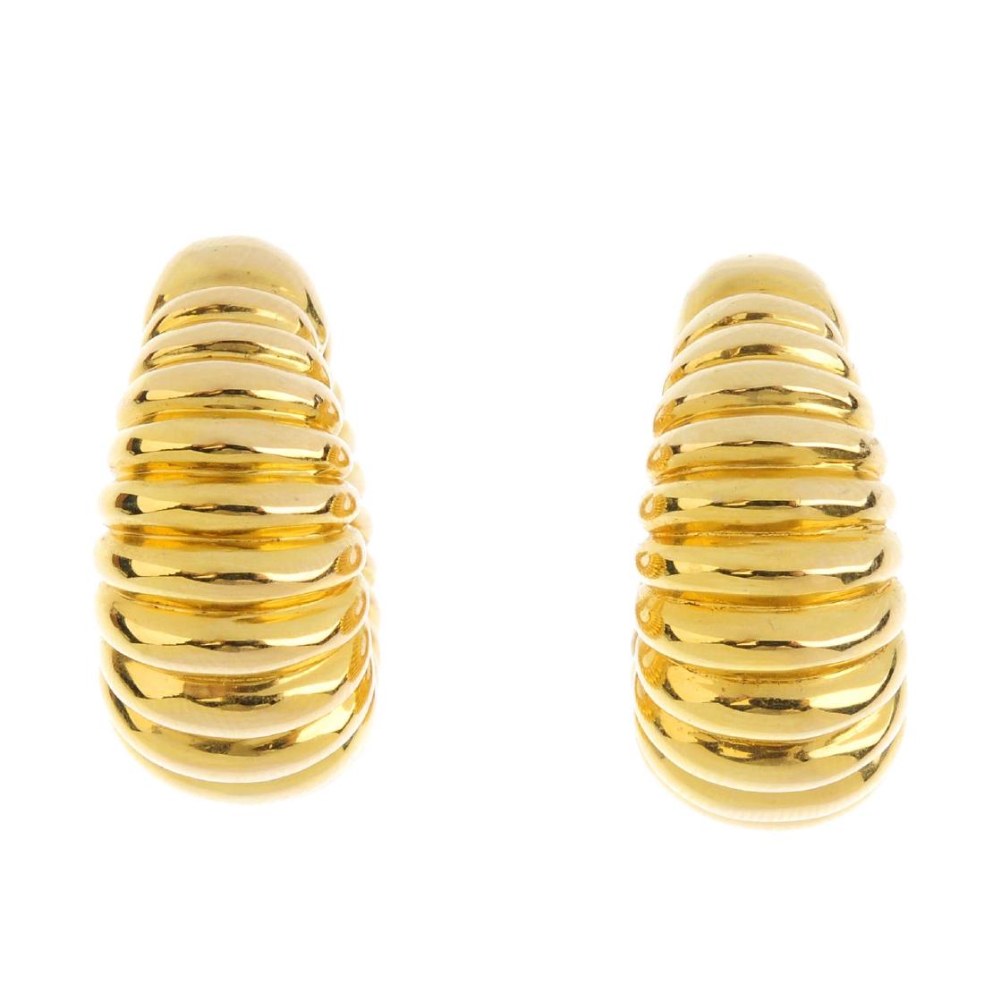 CHIMENTO - a pair of earrings. Each designed as a: CHIMENTO - a pair of earrings. Each designed as a grooved and tapered hoop. Signed Chimento. Italian marks. Diameter 2.5cms. Weight 7gms.