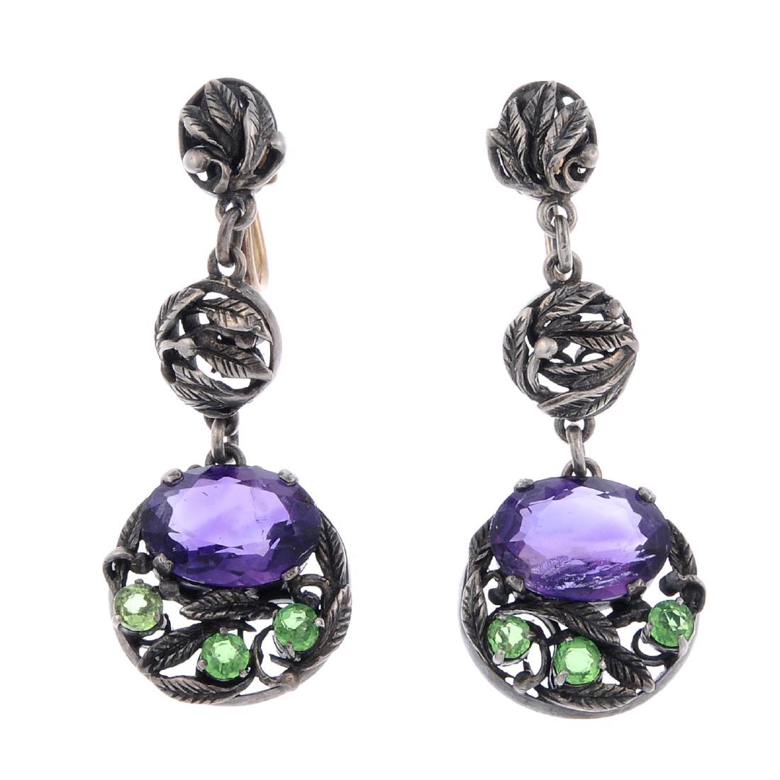 BERNARD INSTONE (attributed to) - a pair of amethyst: BERNARD INSTONE (attributed to) - a pair of amethyst and green paste earrings. Each designed as two articulated foliate circles, suspending a further circular panel set with an oval-shape amethyst and