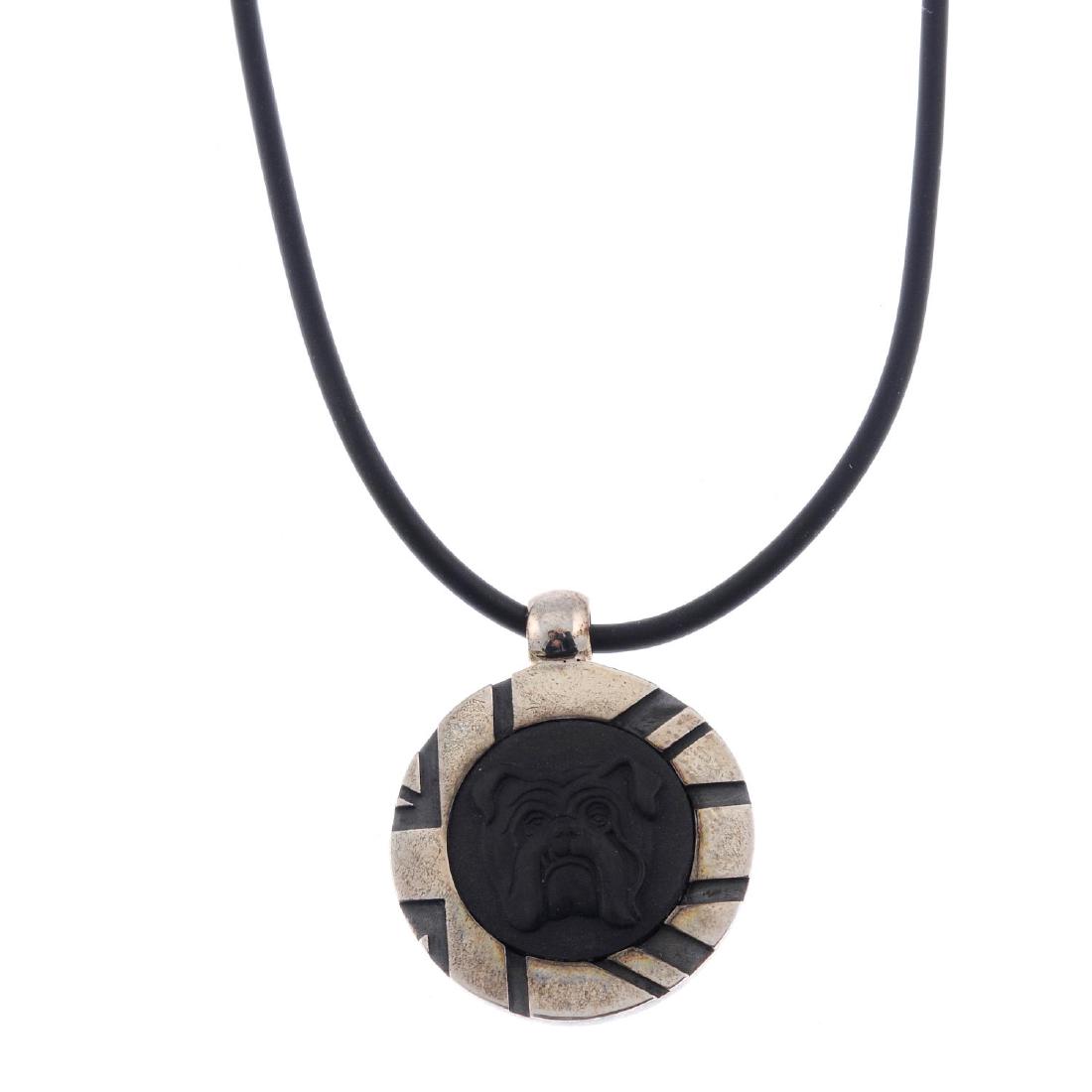 STEPHEN WEBSTER FOR WEDGWOOD - two pairs of cufflinks: STEPHEN WEBSTER FOR WEDGWOOD - two pairs of cufflinks and a pendant. The pendant of circular outline, the black jasperware panel depicting a the head of a bulldog to the stylised Union Jack surround,