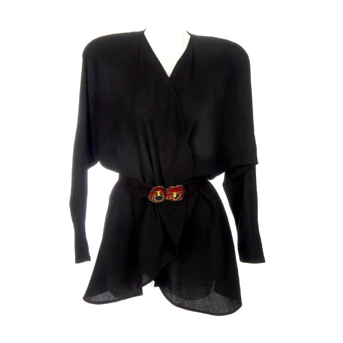 JEAN MUIR - a wool crepe jacket, an enamel pansy buckle: JEAN MUIR - a wool crepe jacket, an enamel pansy buckle suede belt and a suede bib and matching belt. The black wool crepe unlined jacket featuring a collarless waterfall front design, kimono sleeves