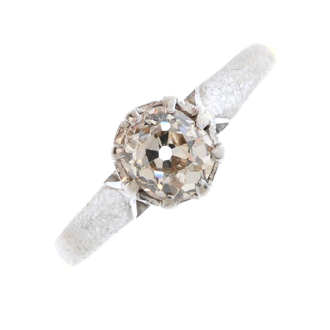 A diamond single-stone ring. Of bi-colour design, the (1 of 3)