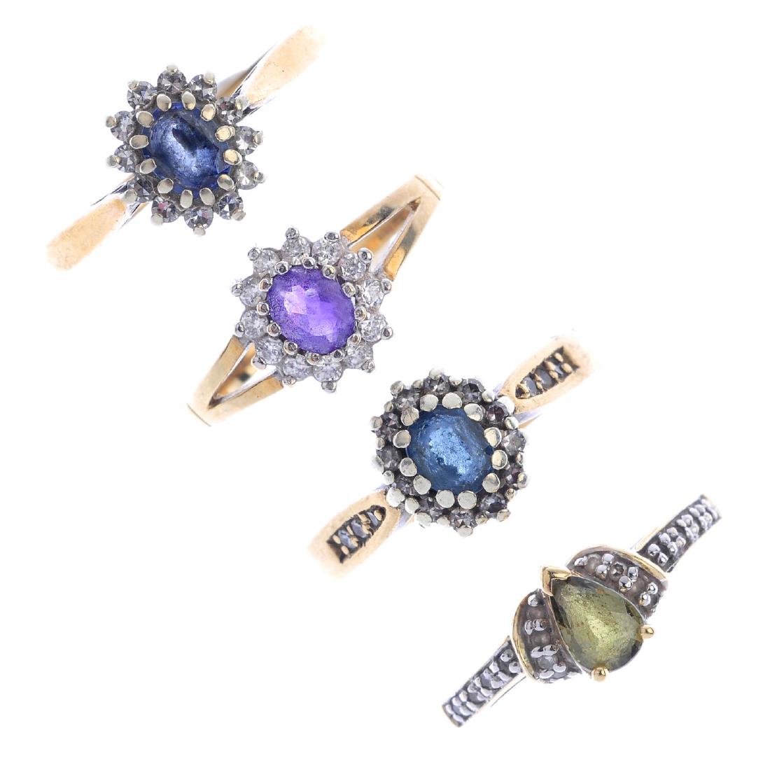 Four 9ct gold gem-set rings. To include a sapphire and (1 of 2)
