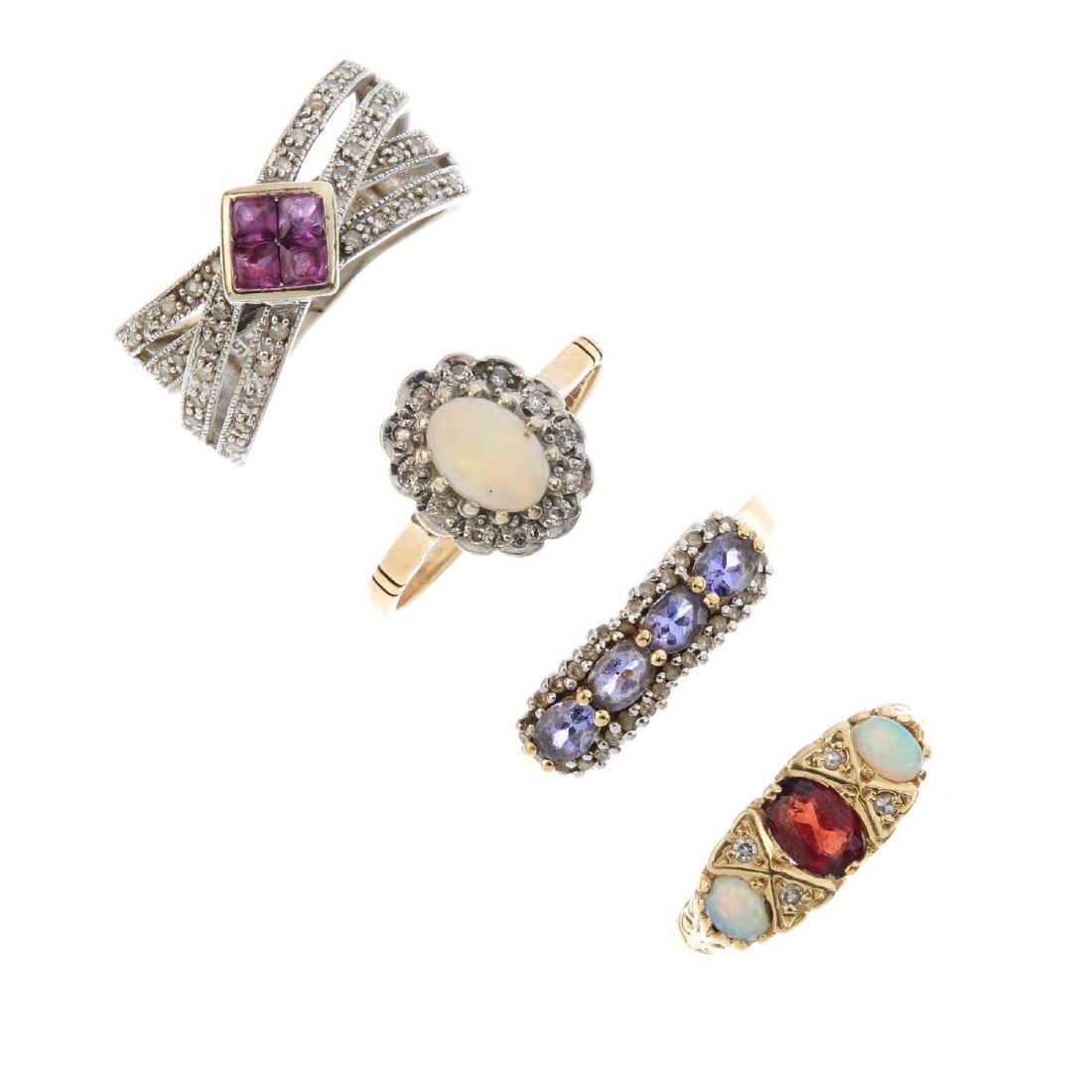 Four 9ct gold gem-set rings. To include an opal and (1 of 3)