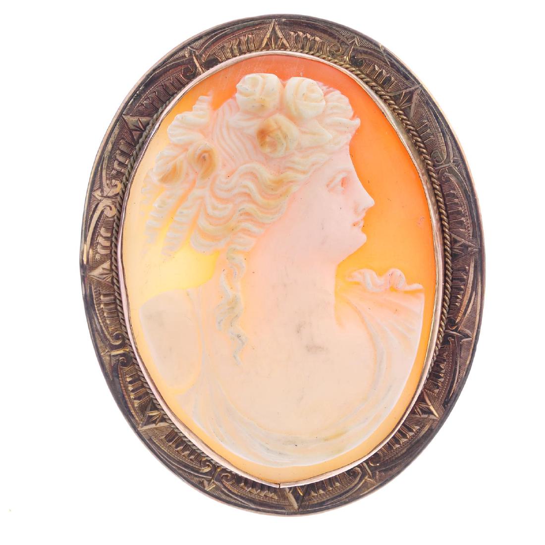A shell cameo brooch. Of oval outline, carved to depict (1 of 2)