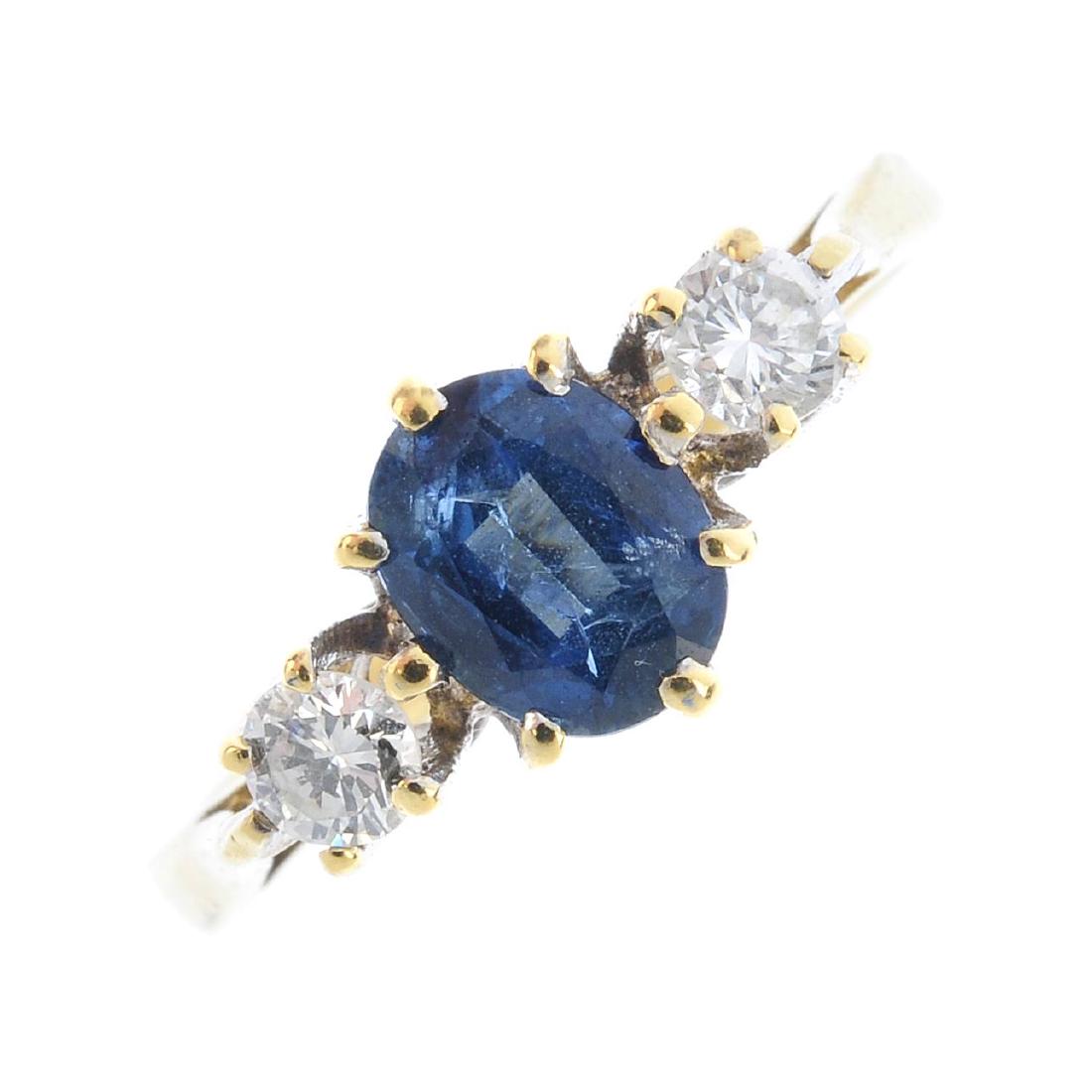 An 18ct gold sapphire and diamond ring. The oval-shape (1 of 3)