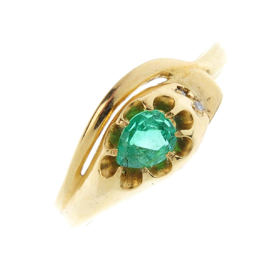 An emerald snake ring. Designed as a coiled snake, with (1 of 3)
