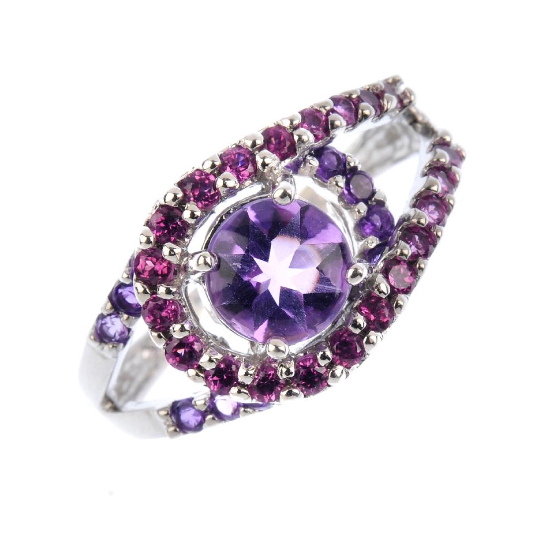An amethyst dress ring. The fancy-cut circular-shape (1 of 3)