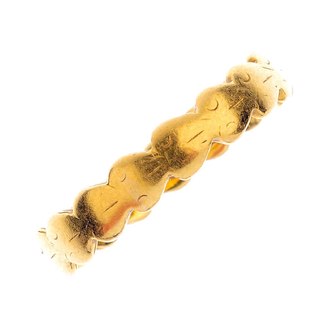 A 1950's 22ct gold band ring. Designed as heart motif (1 of 2)