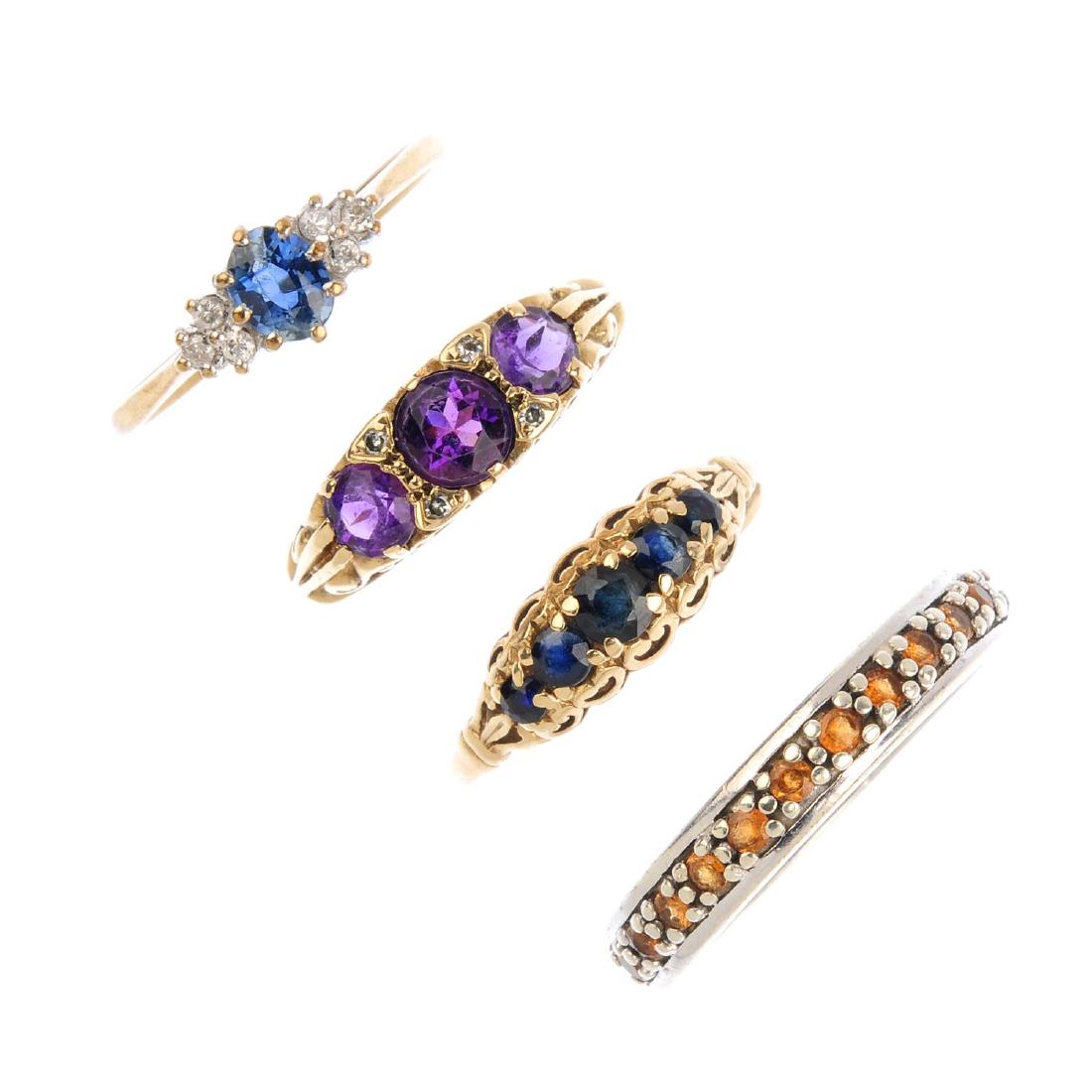 Four 9ct gold gem-set rings. To include a sapphire (1 of 2)