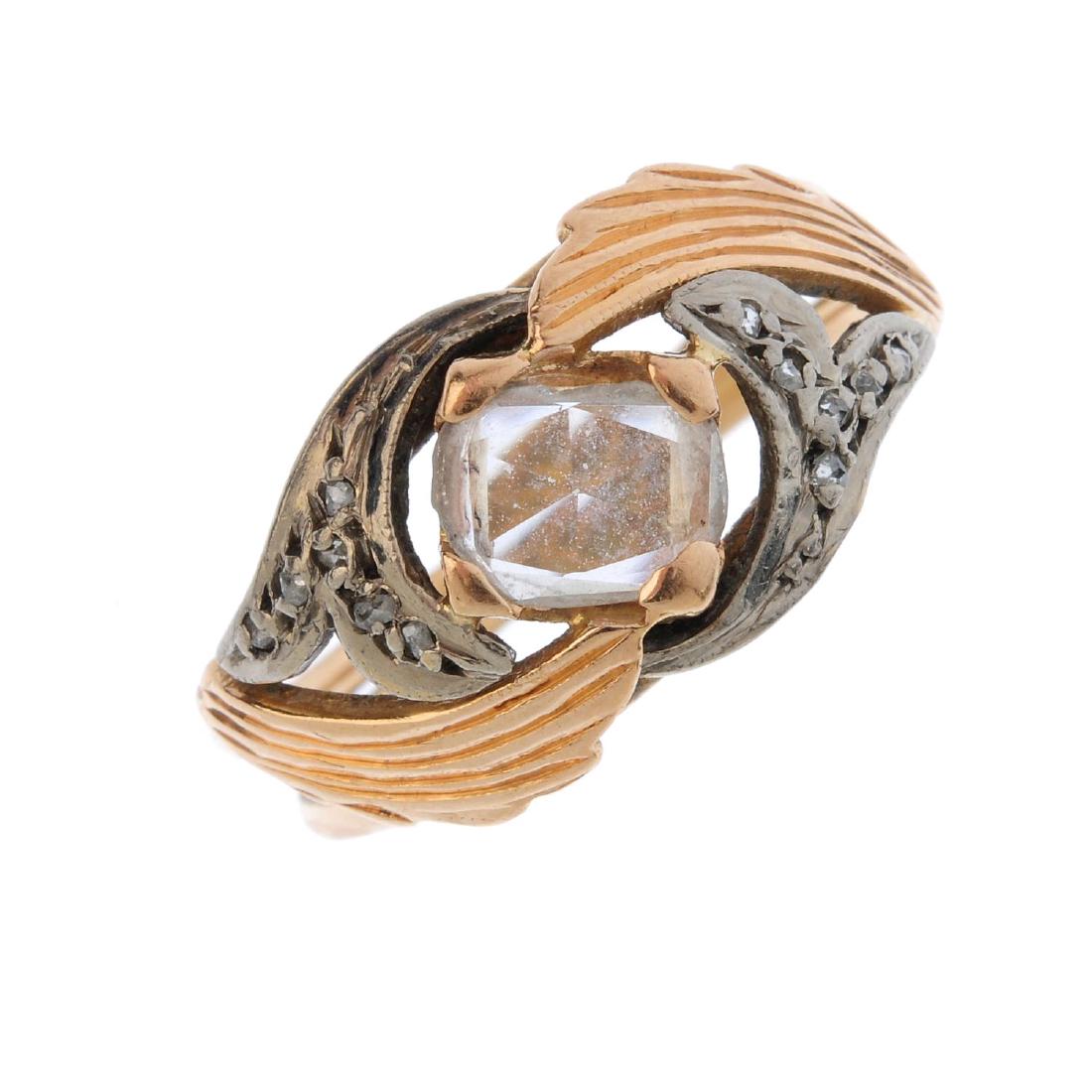 A diamond cluster ring.  Of bi-colour design, the (1 of 3)