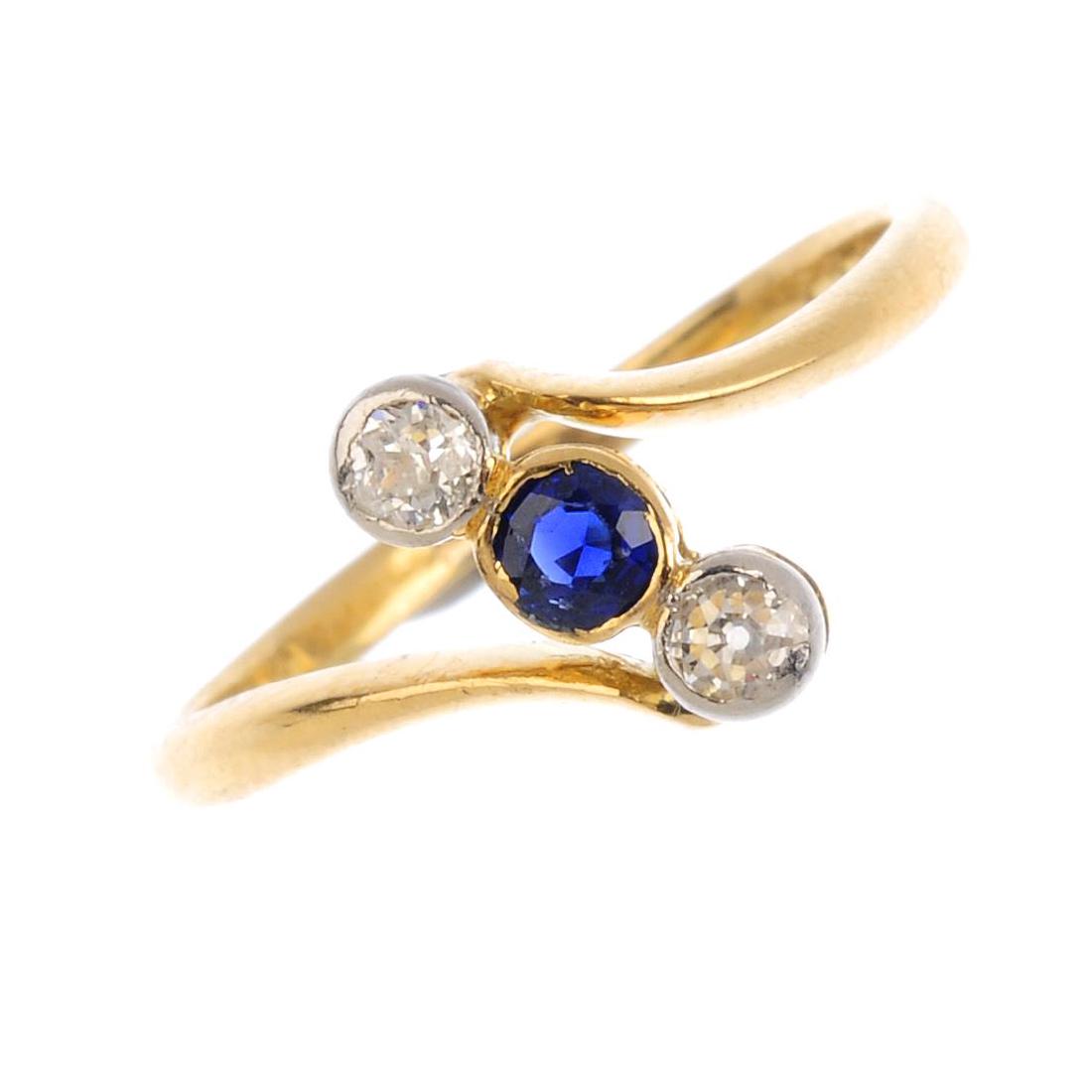 A sapphire and diamond crossover ring. The (1 of 3)