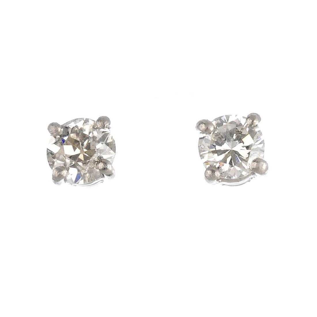 A pair of platinum brilliant-cut diamond stud earrings. (1 of 2)