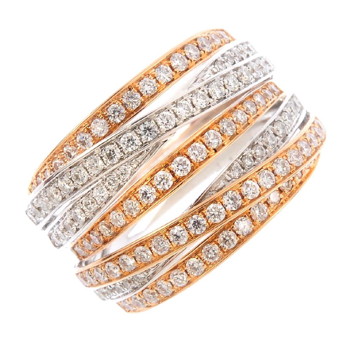 An 18ct gold diamond crossover ring. Of bi-colour (1 of 3)