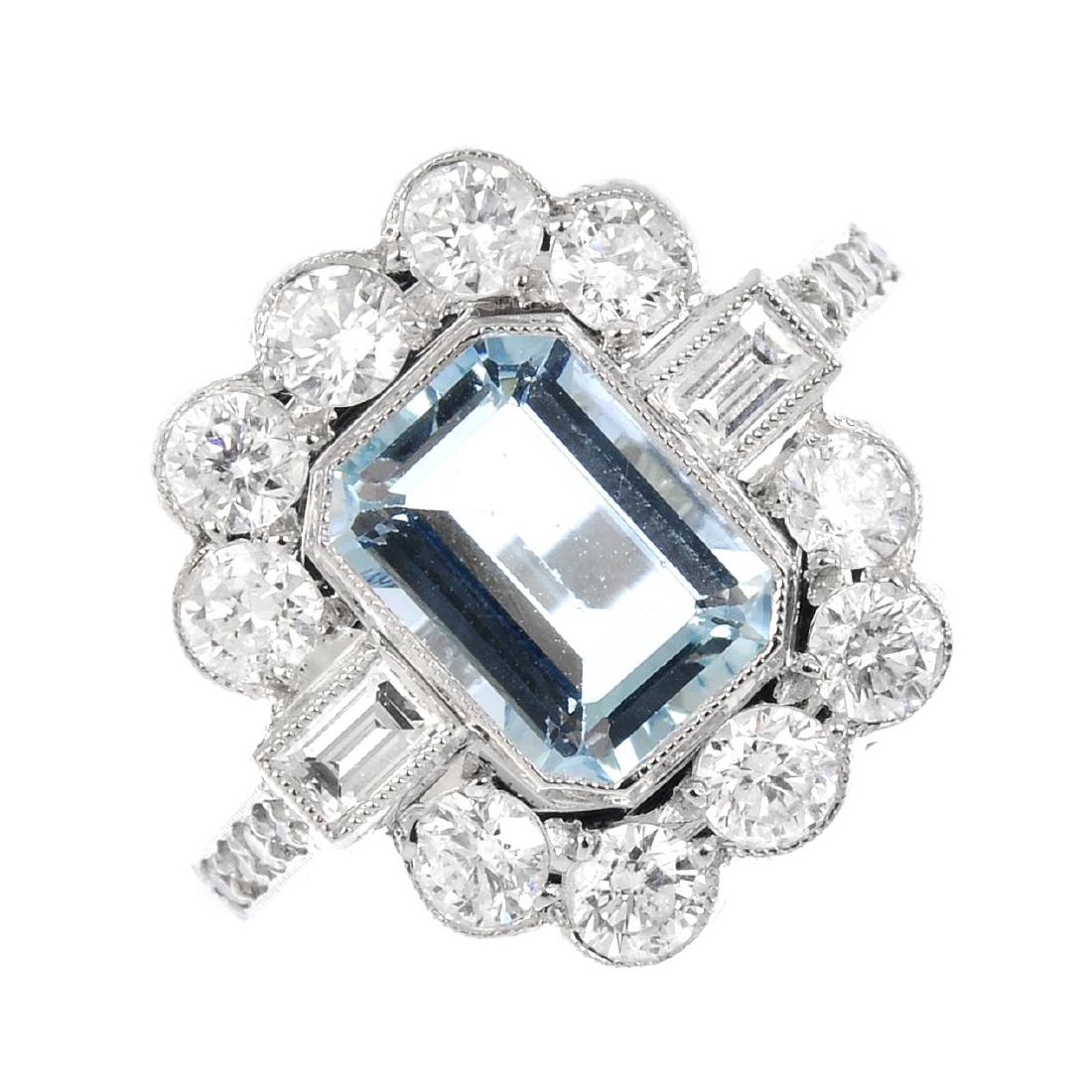 An aquamarine and diamond cluster ring. The (1 of 4)