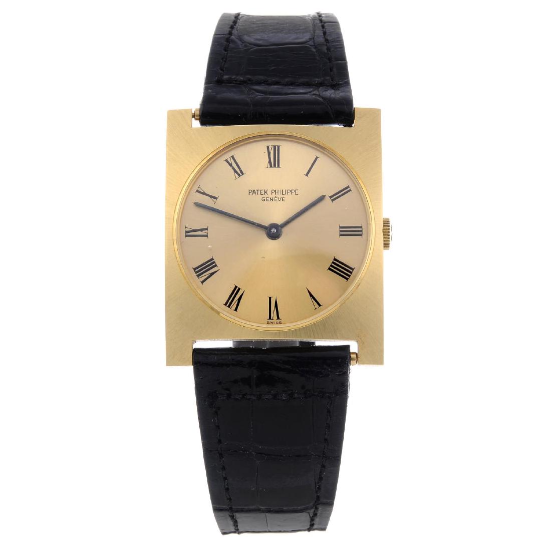 PATEK PHILIPPE - a gentleman's wrist watch. Yellow: PATEK PHILIPPE - a gentleman's wrist watch. Yellow metal case, stamped 0.750. Reference 3557, serial 2666935. Signed manual wind movement. Champagne dial with Roman numeral hour markers. Fitted to a s