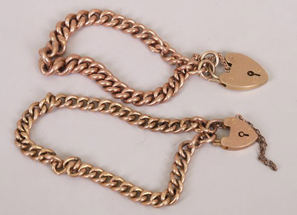 Two 9ct rose gold curb link bracelets with heart p: Two 9ct rose gold curb link bracelets with heart padlocks to include one hollow link and one solid link. Total weight 34.8 grams.