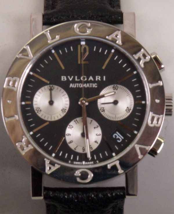 BULGARI - a gentleman's steel case automatic wri: BULGARI - a gentleman's steel case automatic wrist watch the watch having a black dial with three silver coloured subsidiary dials and date aperture the watch has a highly polished circular case and t
