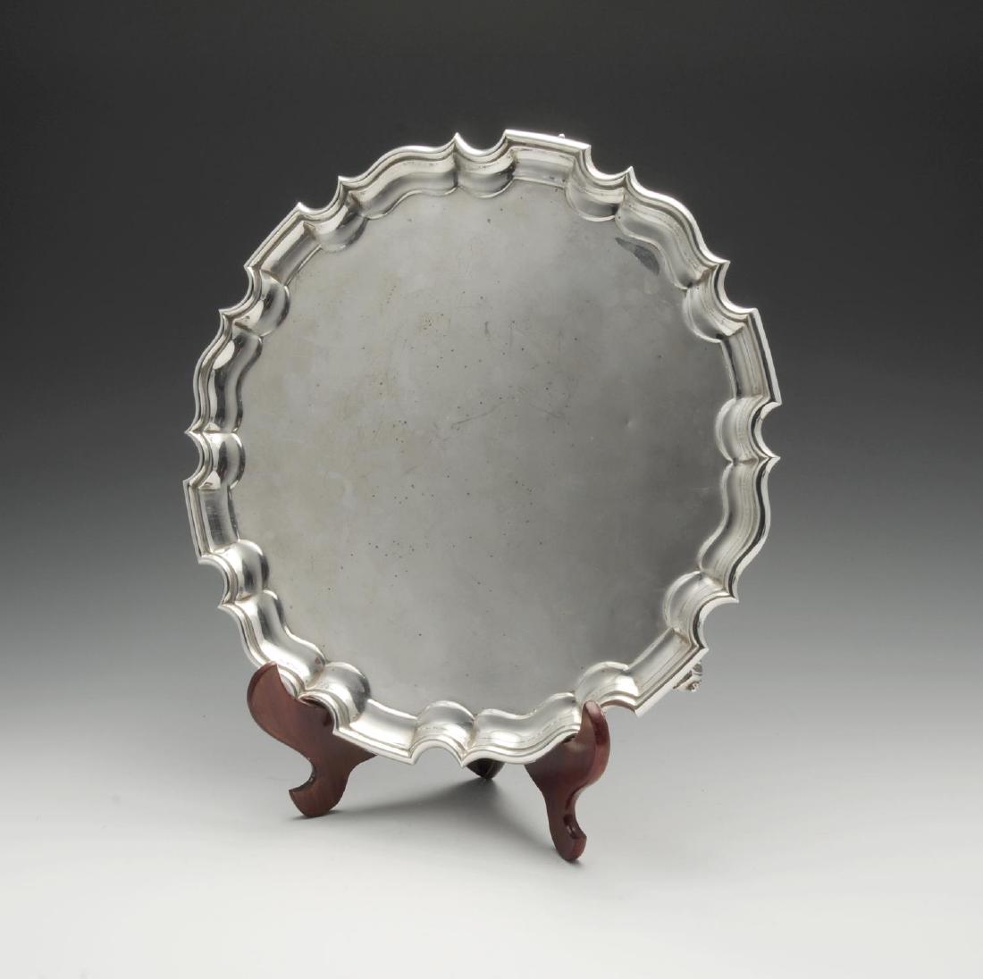 A 1930's silver salver, the circular form with (1 of 3)