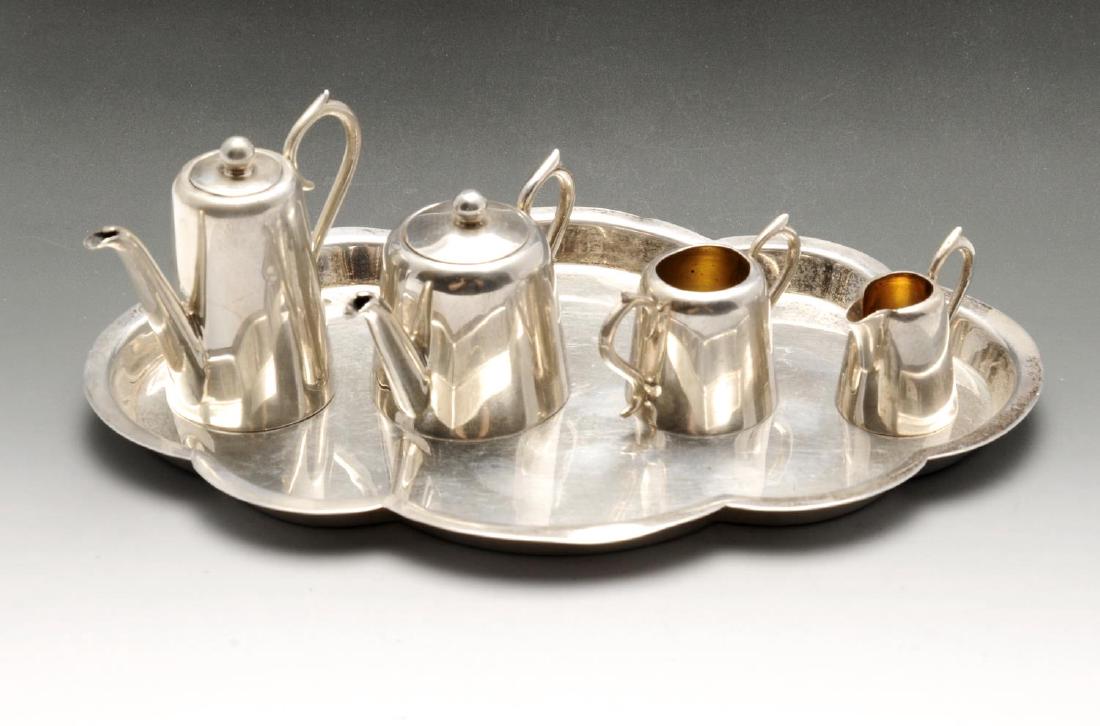 An Edwardian silver miniature or toy four piece tea (1 of 3)