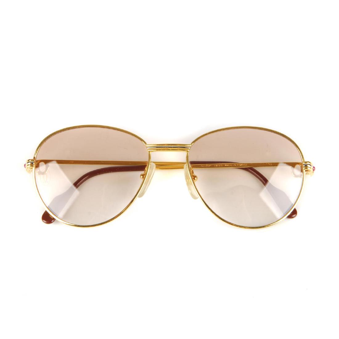 CARTIER - a pair of rose tinted sunglasses. Featuring (1 of 5)