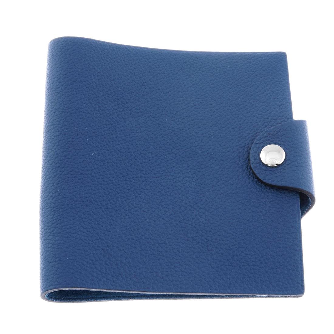 HERMÈS - a blue leather Ulysse notebook cover. Designed (1 of 2)